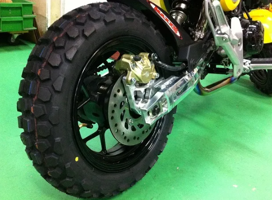 The Honda Grom Off-Road Tire with plate number Duro HF903